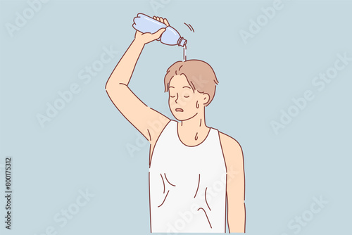 Man suffering from sunstroke pours water from bottle on head to cool down after long run