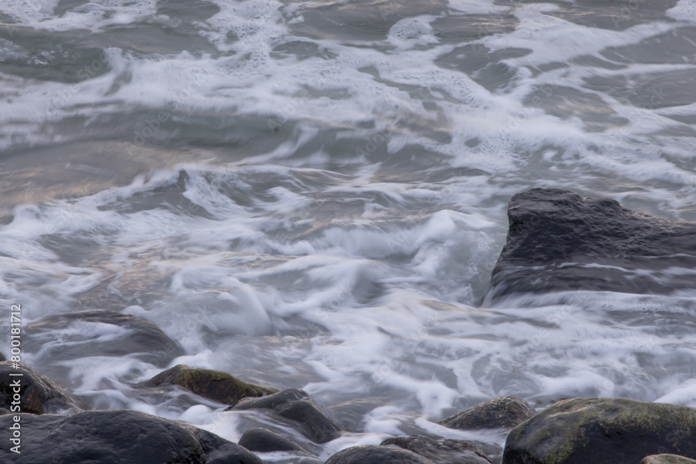 Ocean waves crashing on a rocky shore Ocean waves crashing on a rocky shore