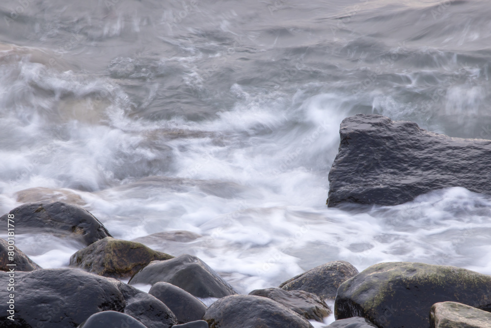 Ocean waves crashing on a rocky shore Ocean waves crashing on a rocky shore