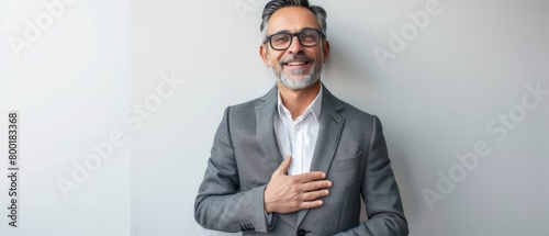 Confident Middle-Aged Businessman Smiling in Stylish Business Attire, Copy Space