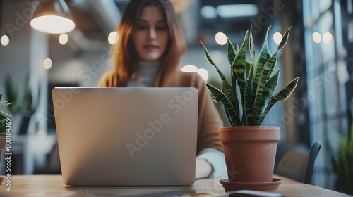 a businesswoman wear casual clothing and using laptop in office, blurred background. generative AI photo