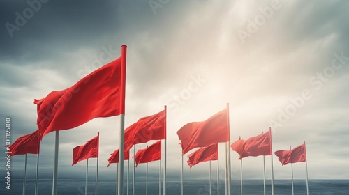 Red flags blowing in the wind photo
