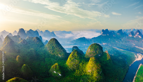 Aerial view of the beautiful karst mountains and sky clouds natural landscape at sunrise in Guilin, China. Famous mountain landscape in summer. photo