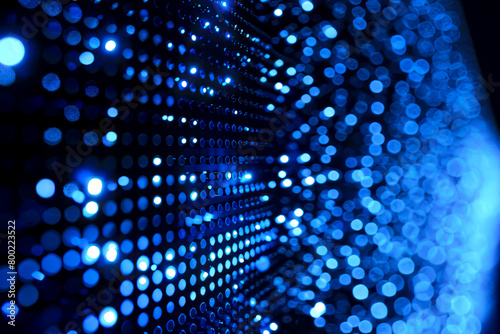 Neon Blue Dotted Background: A Creative Collection of Small Neon Blue Dots on a Black Background photo