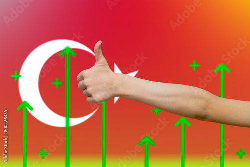 Turkey flag with green up arrows, increasing values and improving economy,  finger thumbs up front 