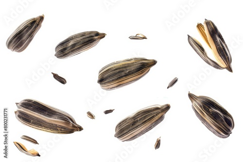 Flying sunflower seeds on white background