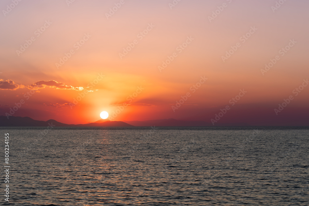 Red sunset at the Van Lake for purpose of web and design use, sun is at the left side of photo