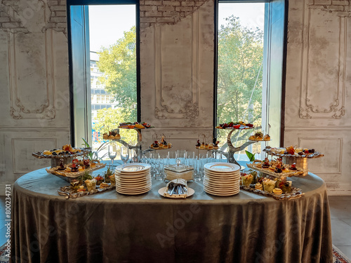 a catering table in a room with an old stylish decor