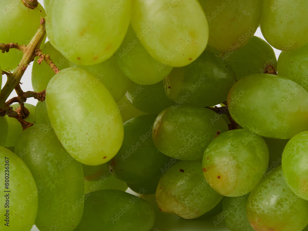 Fresh green grapes with leaves. Isolated on white. stock photo Fresh green grapes with leaves. Isolated on white. stock photo