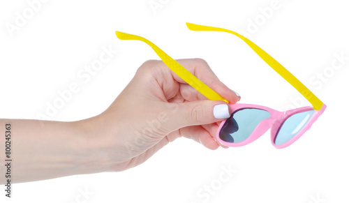 Pink sunglasses for girl baby in hand on white background isolation
