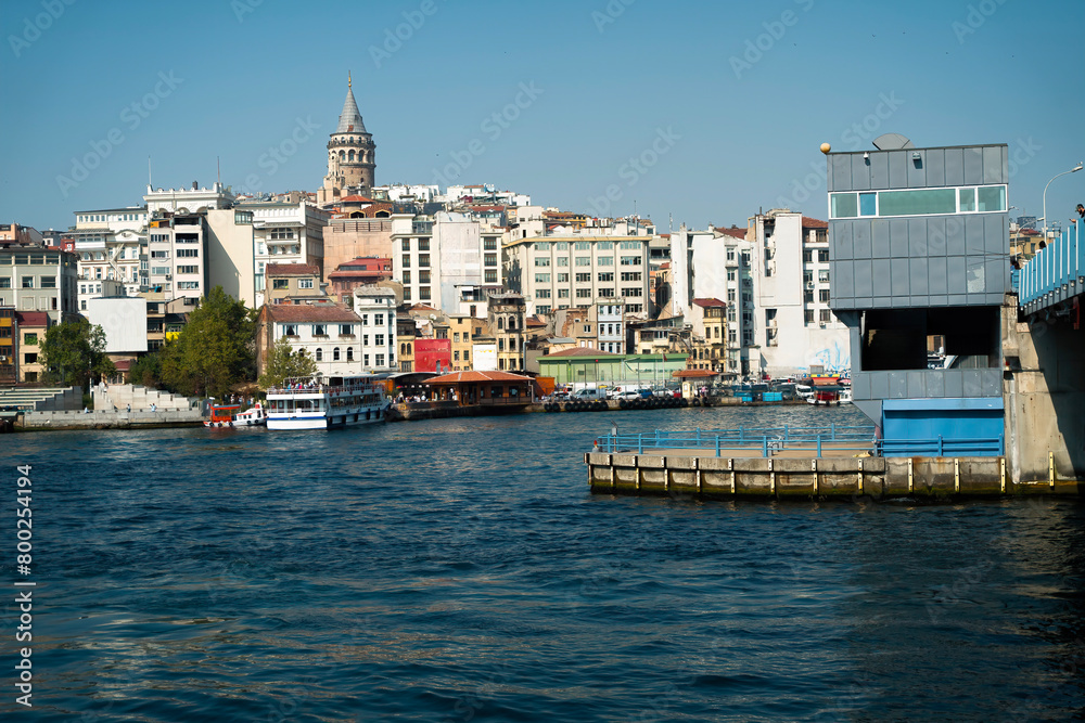 View of the Galata Tower integrated with the sea from the opposite shore of the Golden Horn.