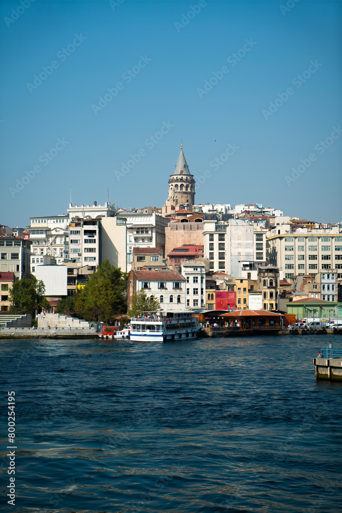 Fototapeta premium View of the Galata Tower integrated with the sea from the opposite shore of the Golden Horn.