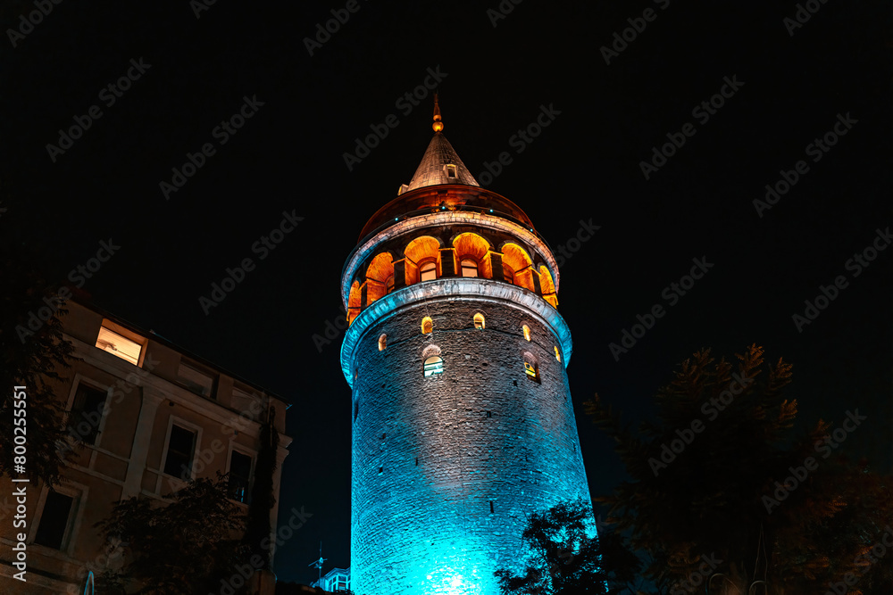 Naklejka premium View of Galata Tower illuminated with lights at night in Istanbul, Turkey.