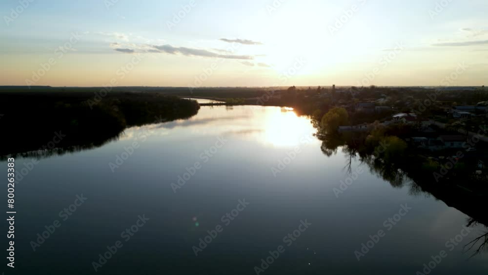 Aerial drone shot of dam lakes during a spring day sunset. Romanian fishing spots seen from above. Peaceful water storage by a village and farmland in eastern europe. High angle footage of crops.
Aeri Aerial drone shot of dam lakes during a spring day sunset. Romanian fishing spots seen from above. Peaceful water storage by a village and farmland in eastern europe. High angle footage of crops.
Aeri