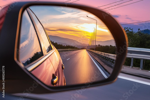 highway view in car mirror at sunset © Halilbrahim