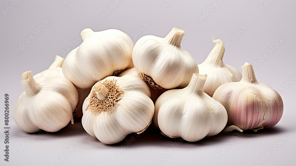 Isolated fresh garlic pile against a stark white background Isolated fresh garlic pile against a stark white background