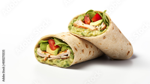 rolled sandwiches with avocado and chicken separated against a white background photo