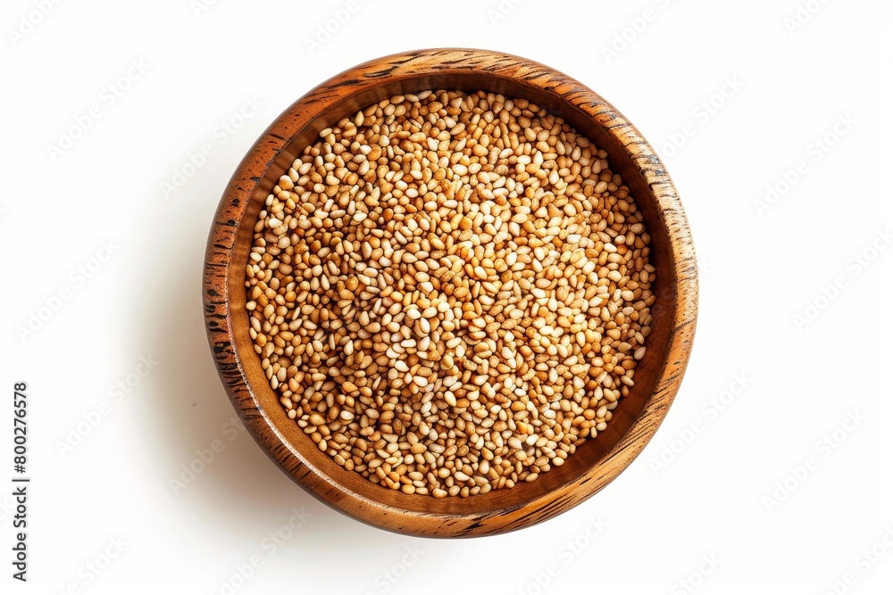 Overhead shot of sesame seeds in wooden bowl on white background Overhead shot of sesame seeds in wooden bowl on white background