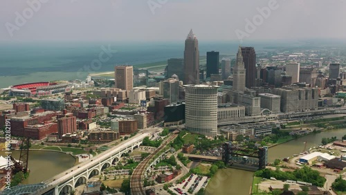 Aerial View of Cleveland, Ohio Sunny Day Drone Shot of Cuyahoga River and Innerbelt Bridge in 4K photo