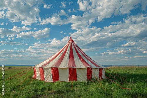 Red and white tent in the meadow