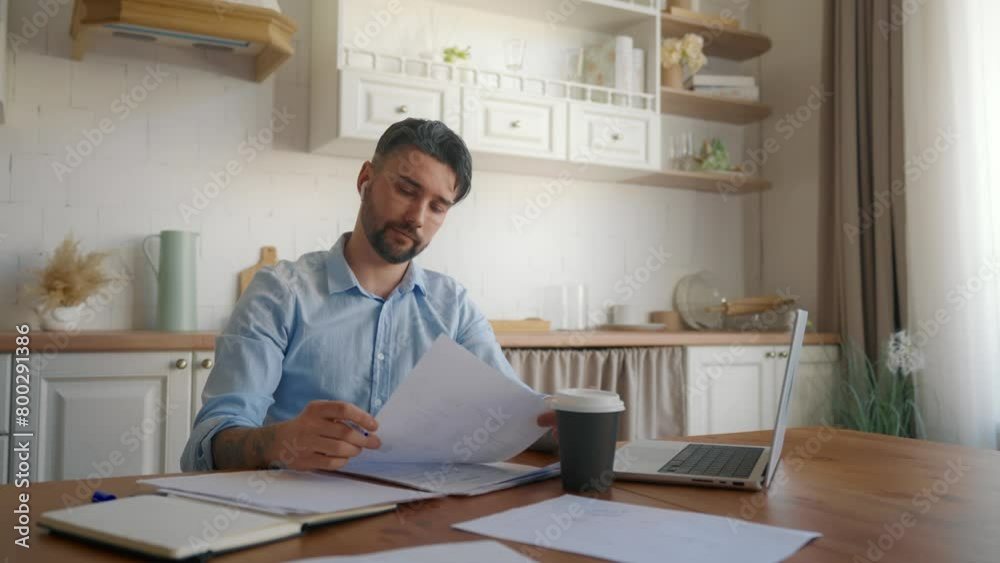 Handsome man drinking coffee at work. Thoughtful business man entrepreneur working on laptop computer Drinking Tea or Coffee thinking about future. Home office, freelance creative job, online concept. Handsome man drinking coffee at work. Thoughtful business man entrepreneur working on laptop computer Drinking Tea or Coffee thinking about future. Home office, freelance creative job, online concept.