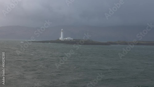 Hand-held shot of the Lismore Lighthouse situated on the island of Eilean Musdile photo