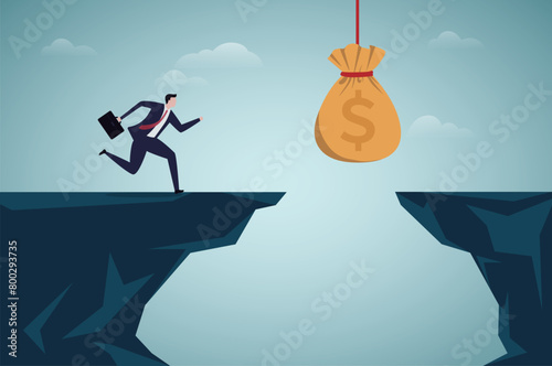 Money temptation and trap. Businessman running to a money bag hanging over cliff.