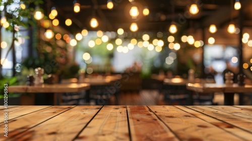 Wooden tabletop foreground with a blurred restaurant background, featuring warm bokeh lighting. photo