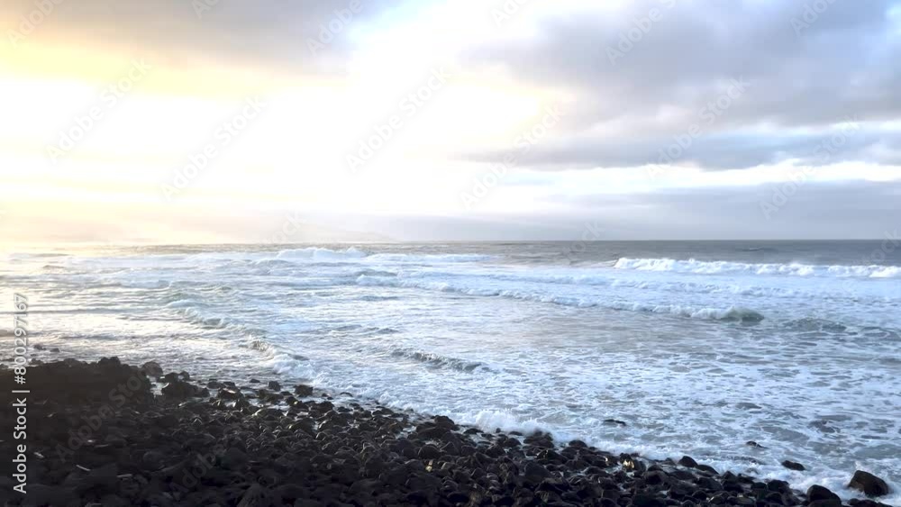 Scenic view of ocean waves crashing against the shoreline, illustrating the concept of natural beauty and serenity. Scenic view of ocean waves crashing against the shoreline, illustrating the concept of natural beauty and serenity.