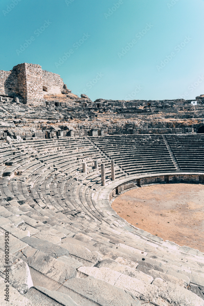 Theater at Miletus. Ancient Theatre stands in ruin, its curved stone tiers telling tales of bygone spectacles. Vertical. Milet (Aydin), Turkey (Turkiye)