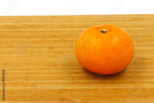 orange on wooden table