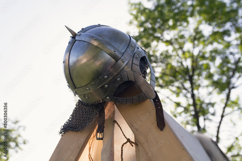 Naklejka premium Viking helmet at tent camp at the historic festival