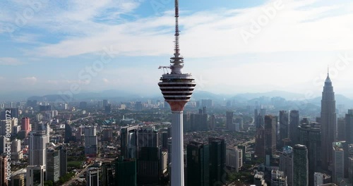 KL Tower On Sunny Day In Kuala Lumpur, Malaysia. aerial shot, zoom-in photo