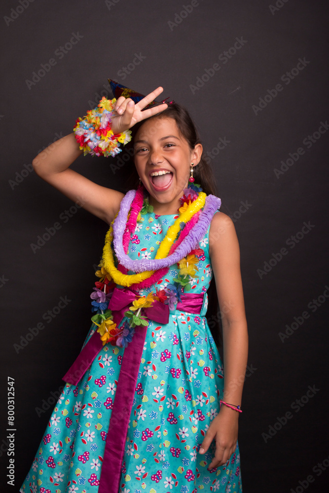 girl with party dress and confetti smiling