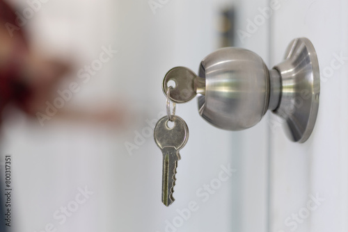 Close up of house keys and doorknobs.
