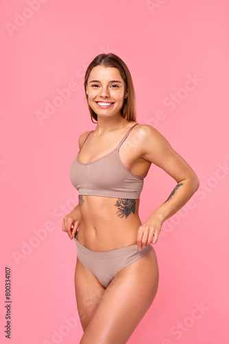 Cosmetology, beauty and spa treatment. Woman in lingerie on pink background.