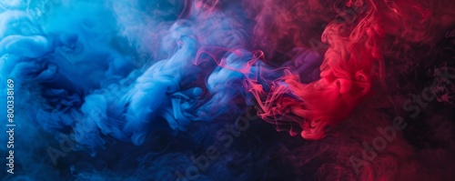 Vibrant blue and red smoke intertwining on a dark background photo