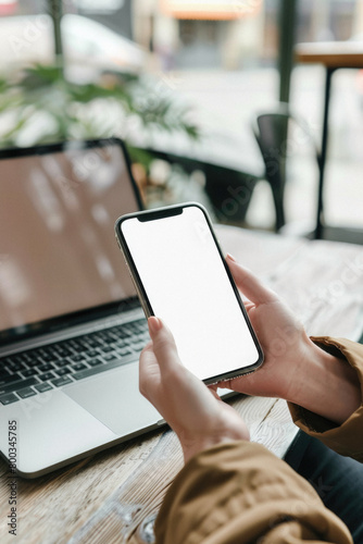 Business person man or woman holding smartphone showing mock up blank white empty mobile phone screen, hands using cellphone close up view. Mockup display for applications ads.