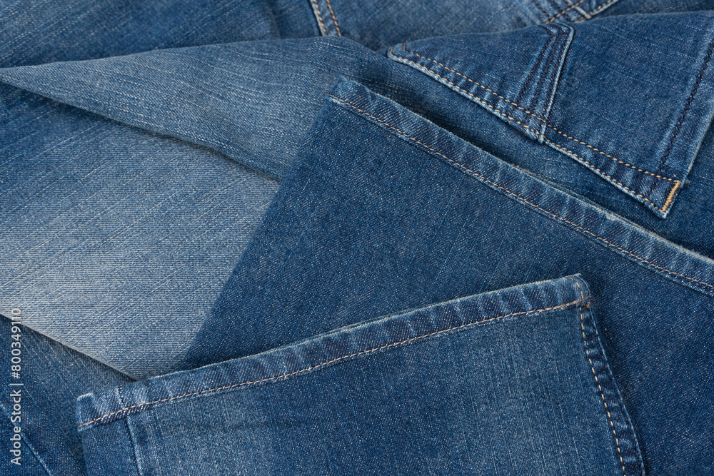 Fototapeta premium Blue jeans denim texture as a background. Top view.