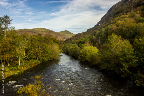 The river Glaslyn  Aflon Glaslyn   flowing through a wooded gorge in the mountains surrounding the small Welsh village of Beddgelert in Eryri National Park