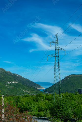 power lines in the mountains © TatiG