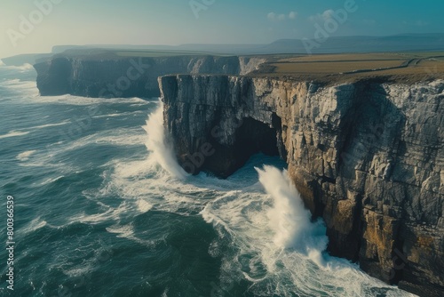 Nature's Fury: Aerial View of Cliffside Waves