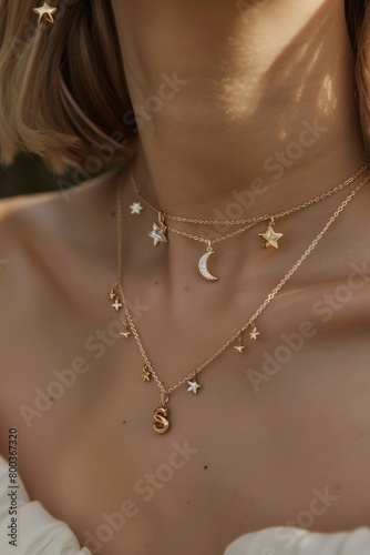 Reduced gold necklace with small pendant featuring diamonds, moon and star motifs.