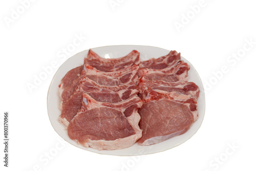 Fresh pork steaks on the plate on the white background