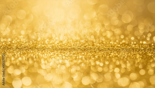 Golden background. Luxury and shiny gold texture. Abstract surface for luxurious design.