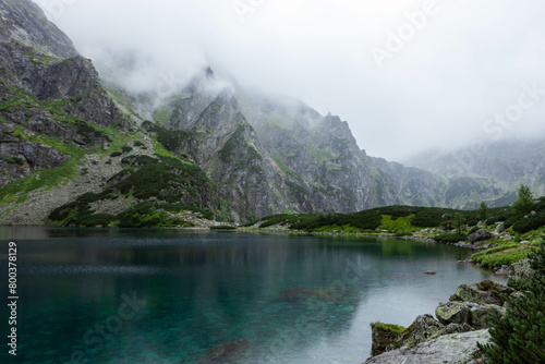 Morskie Oko (Eye of the Sea) in Tatra National Park in Poland on rainy cloudy day.