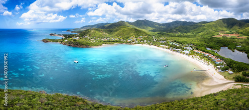 Panoramic aerial view of Carlisle Bay with lush rain forest and turquoise and emerald sea, Antigua and Barbuda, Caribbean