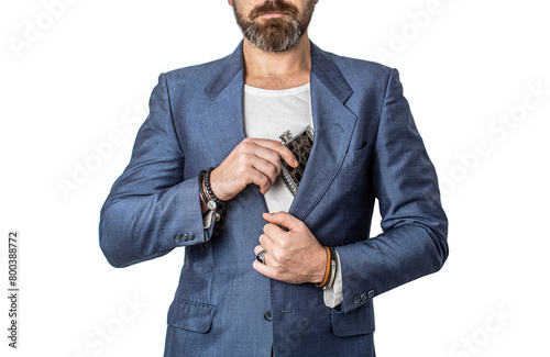 Man taking a flask out of his suit pocket. Male with beard put whiskey flask in pocket. Man drink alcohol. Flat metal bottle for alcohol. Bearded hipster in suit hold metal flask for alcohol