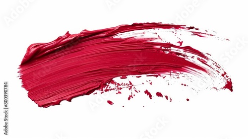 A lipstick smear swatch isolated on a white background, presenting a cream makeup texture with a bright red color.