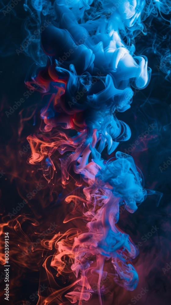 Vibrant blue and red smoke swirls on dark background